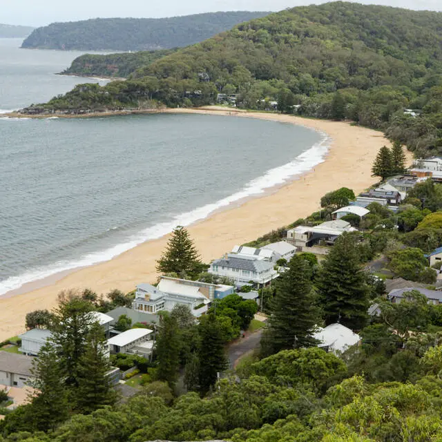 Houses along Coral Crescent towards Green Point at the end of the beach